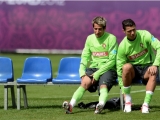 Portugal´s defender Fabio Coentrao (L) and forward Cristiano Ronaldo (R) prepare for a training session at the team's base camp on June 7, 2012 in Opalenica, two days ahead of the team's Euro 2012 opening football match against Germany. AFP PHOTO/ FRANCISCO LEONG        (Photo credit should read FRANCISCO LEONG/AFP/GettyImages)